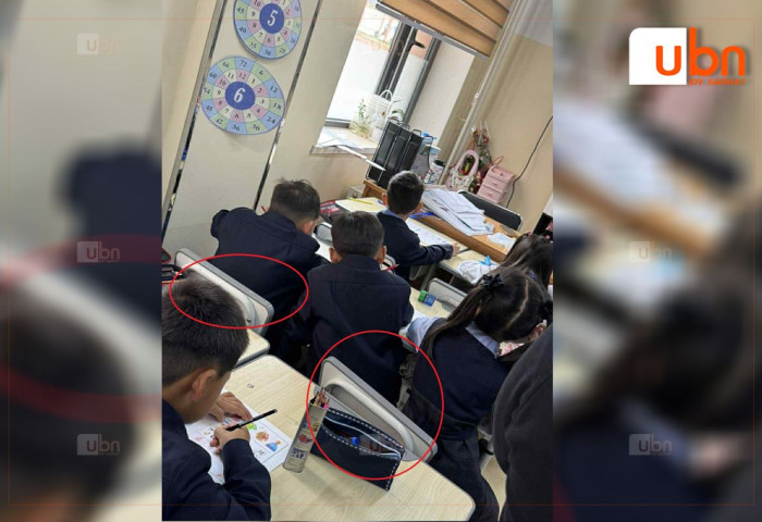 ФОТО: 171 сургуульд анги дүүргэлт хэтэрч, 2 сандал дээр 3 хүүхэд хувааж сууж байна